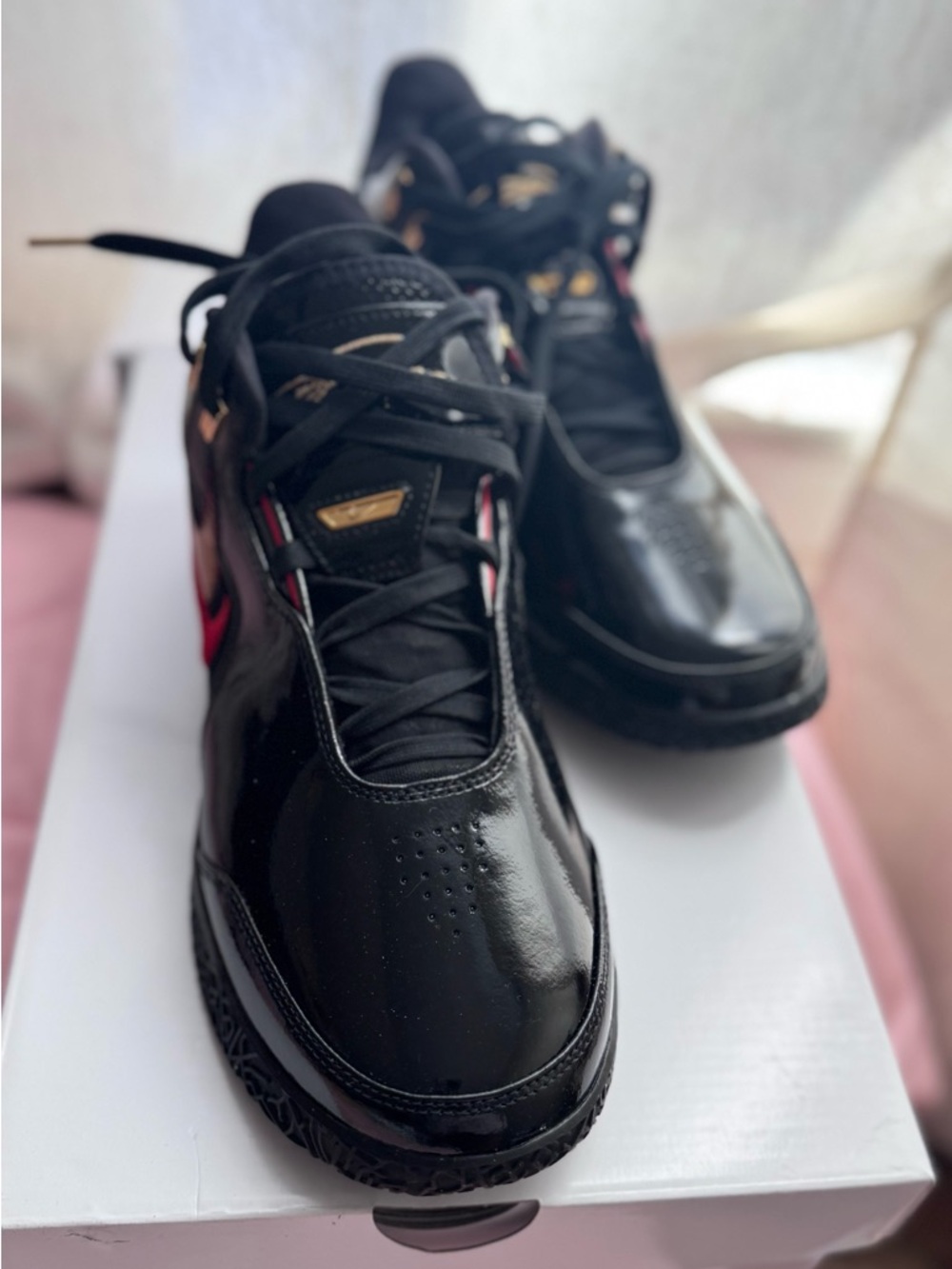 Nike Men’s Black Athletic Shoes with Gold and Red Accents